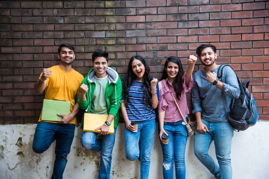 cheerful-indian-asian-young-group-college-students-friends-laughing-together-while-sitting-standing-walking-campus_466689-8627