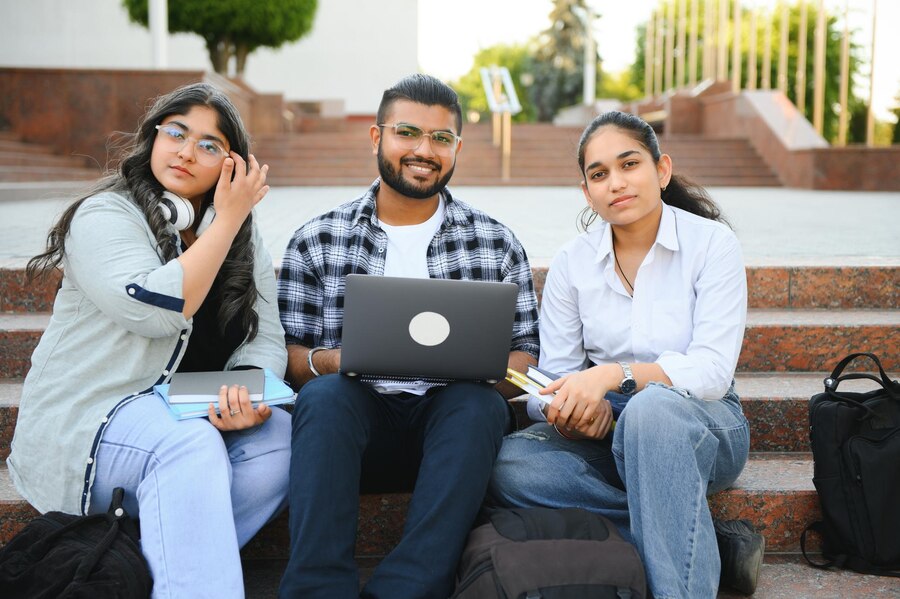 group-young-students-checking-exam-results-waiting-project-approval-laptop-collage-campus_255667-81872