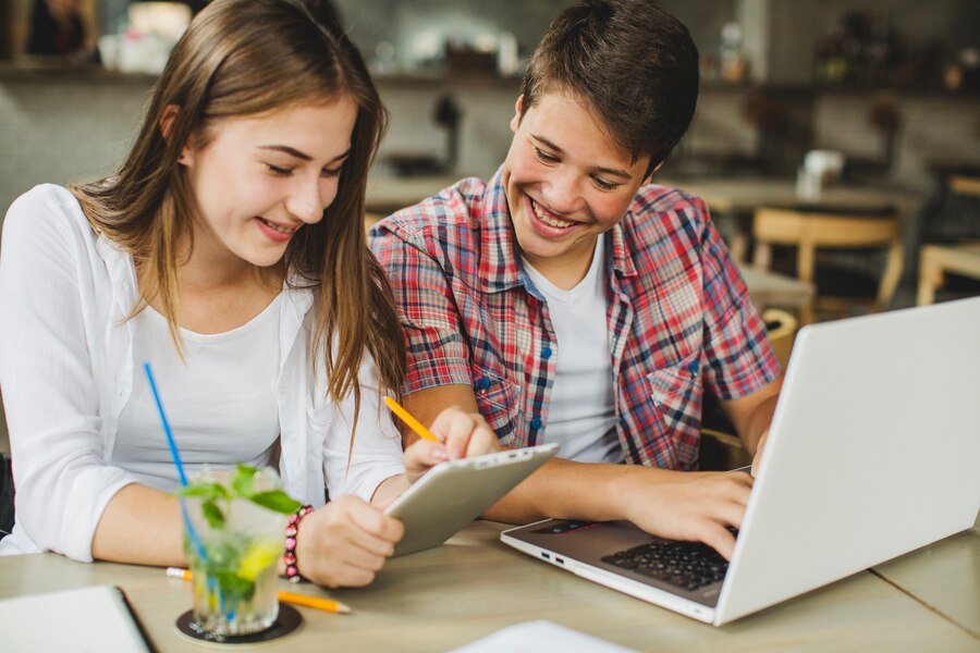 young-girl-boy-with-gadgets_23-2147655828